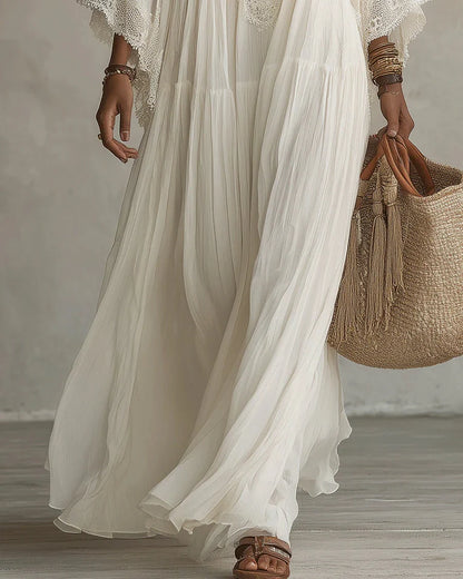 Vestido largo de gasa color marfil con mangas de murciélago y encaje blanco