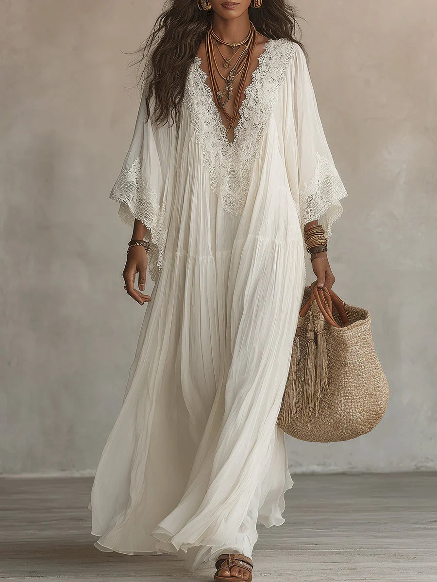 Vestido largo de gasa color marfil con mangas de murciélago y encaje blanco