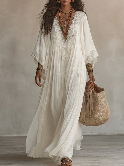 Vestido largo de gasa color marfil con mangas de murciélago y encaje blanco