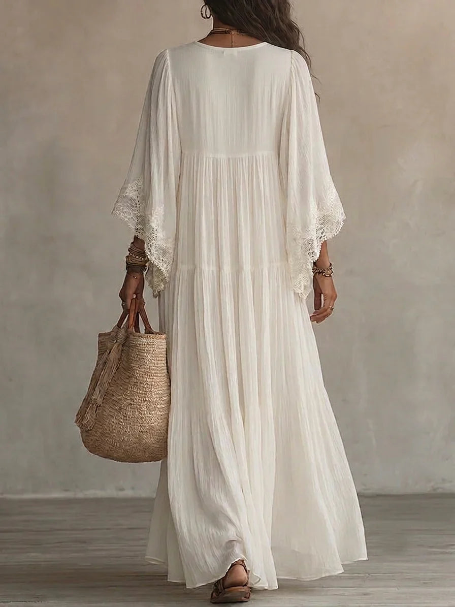Vestido largo de gasa color marfil con mangas de murciélago y encaje blanco