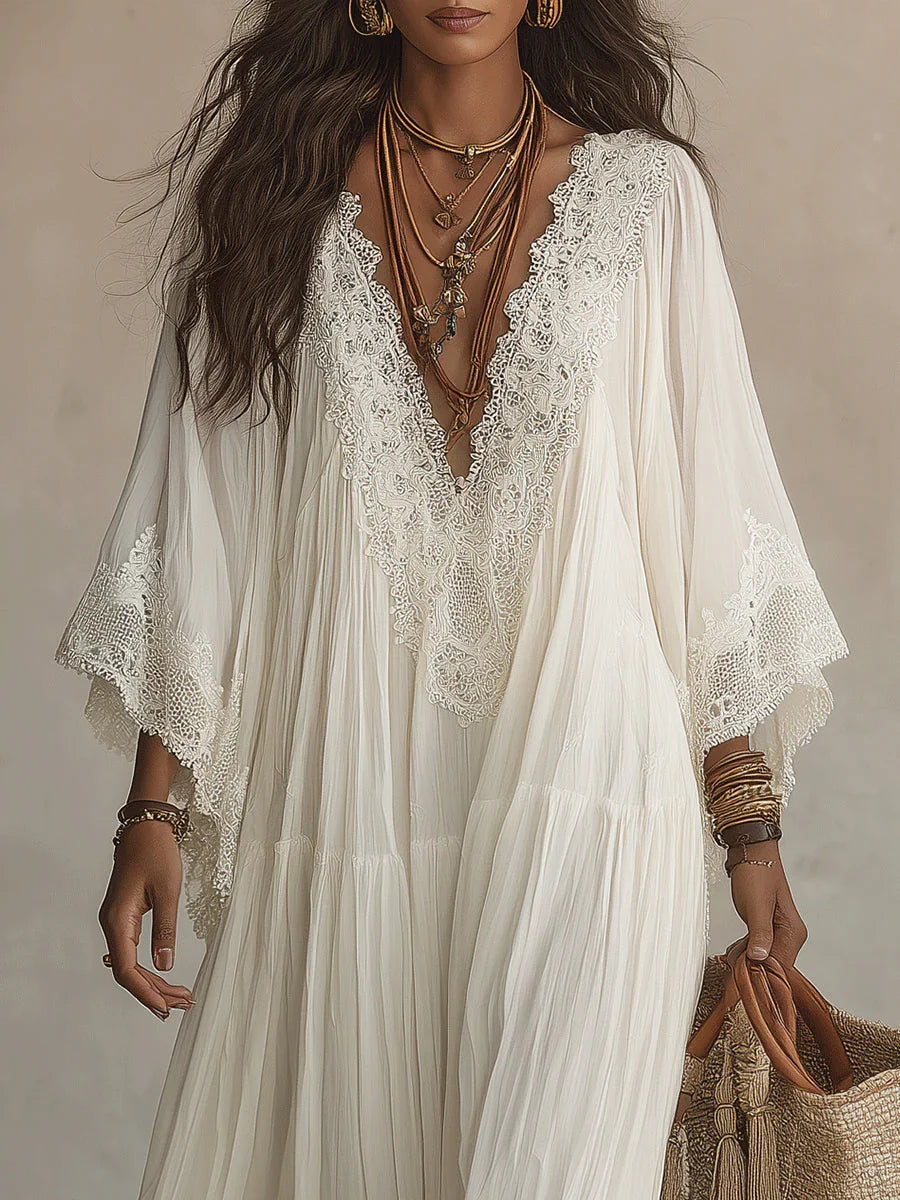 Vestido largo de gasa color marfil con mangas de murciélago y encaje blanco