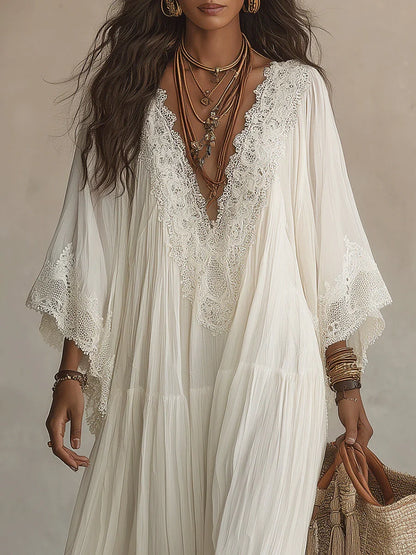 Vestido largo de gasa color marfil con mangas de murciélago y encaje blanco