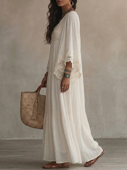 Vestido largo de gasa color marfil con mangas de murciélago y encaje blanco